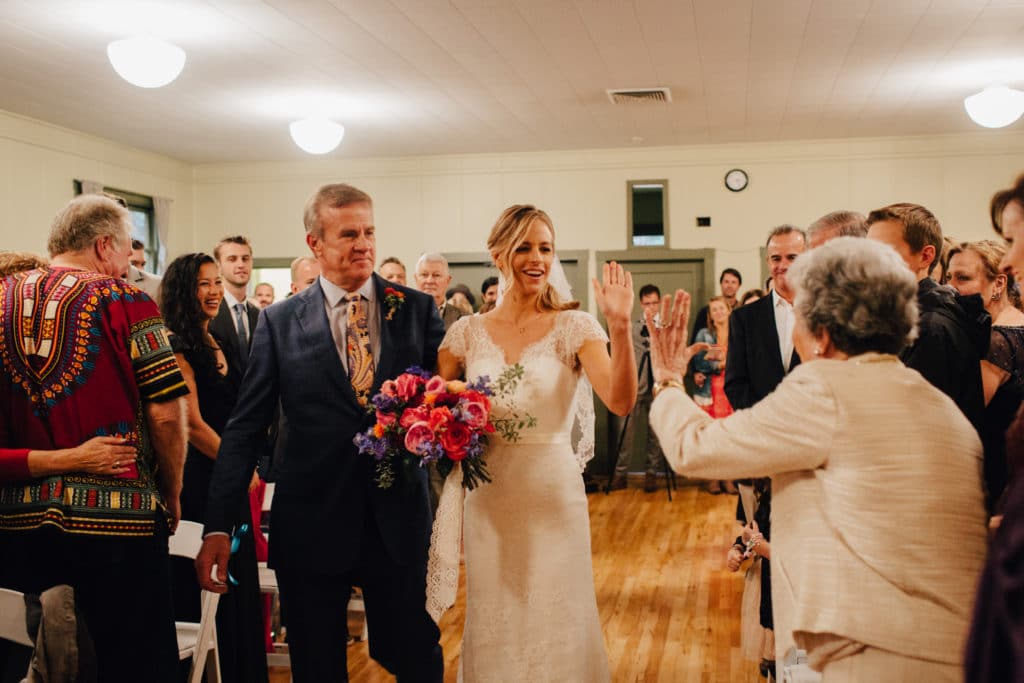 bride high gives thumbs up to grandma