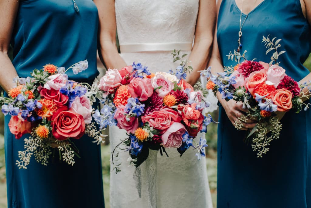 bride and bridesmaids bouquet bright pinks and oranges