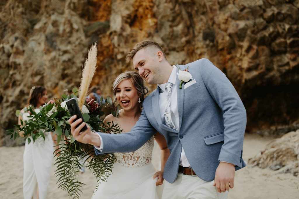 Bride and groom celebrate their elopement bu skyping with their families in Australia