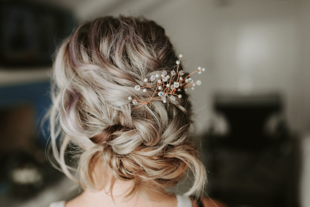 Blond updo with loose braid and hair jewelry for Laguna Beach Elopement