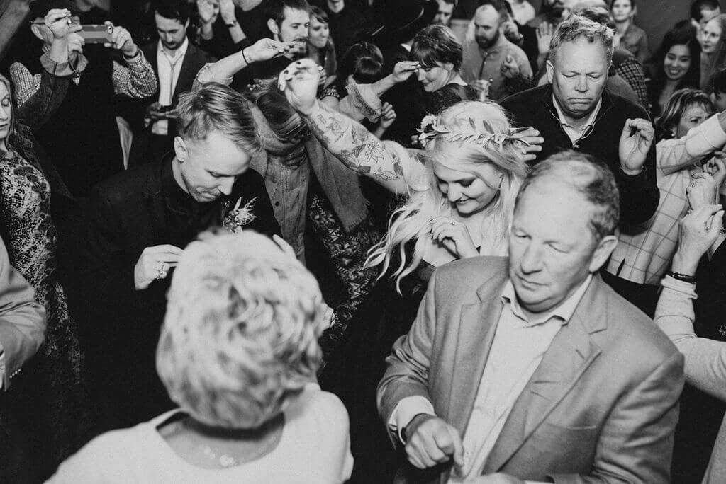 black and white photos of guests dancing at wedding at Under Canvas ZIon