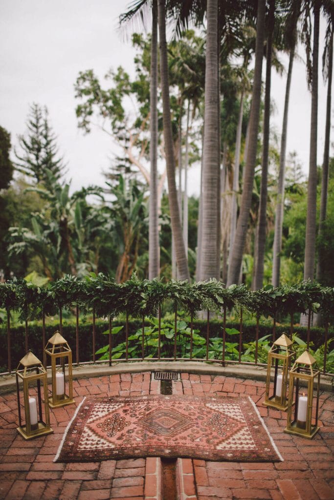 Romantic wedding ceremony decor with boho rug detail