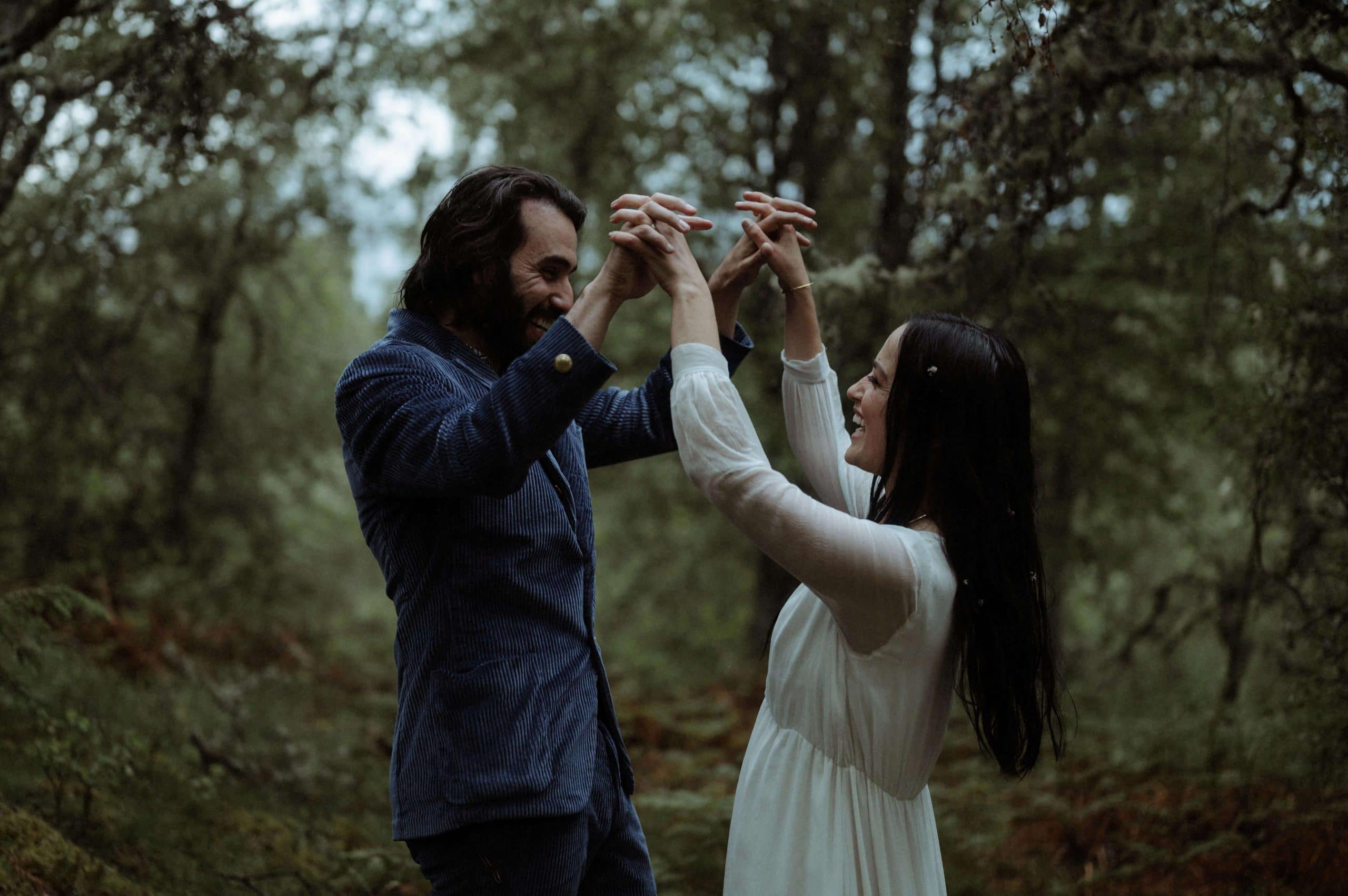 Bride and groom first dance in forest at Inshriach House in Scotland