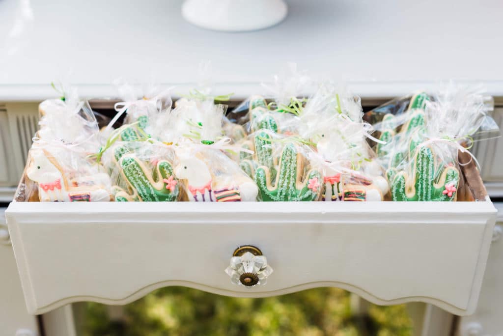 llama and cactus cookies individually wrapped and displayed in a dresser drawer